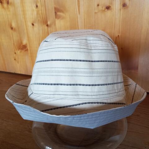 Reversible bucket hat, off white with black & grey stripes and uni light grey